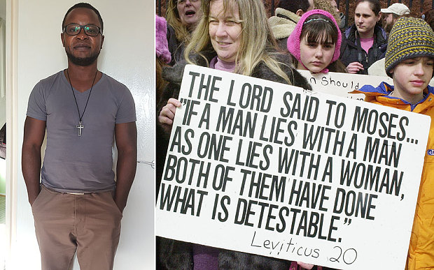 Felix Ngole , left, and Anti-gay marriage protestors hold signs quoting the Bible outside the Massachusetts State House March 11, 2004 