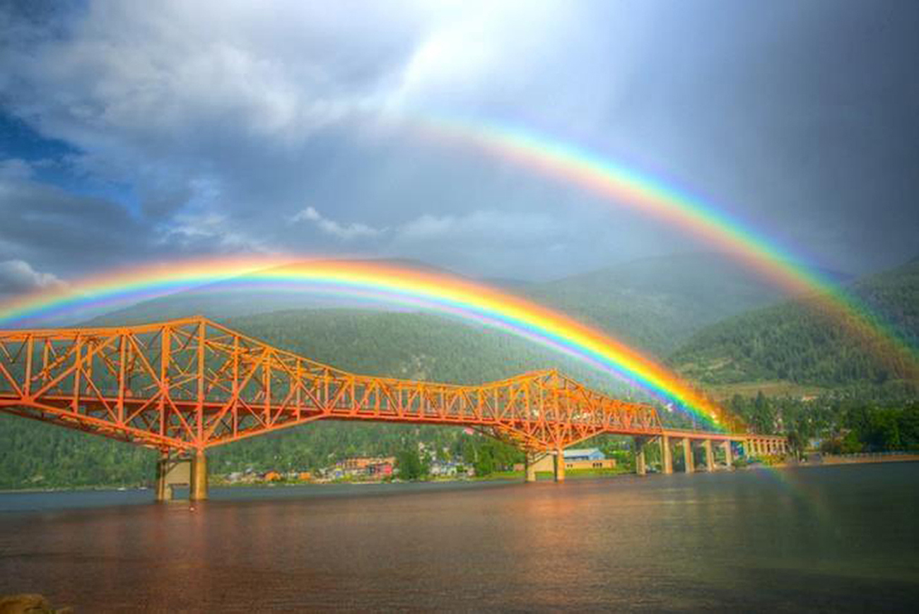 Double rainbows over Kootenay Lake Bridge Nelson, BC, Canada